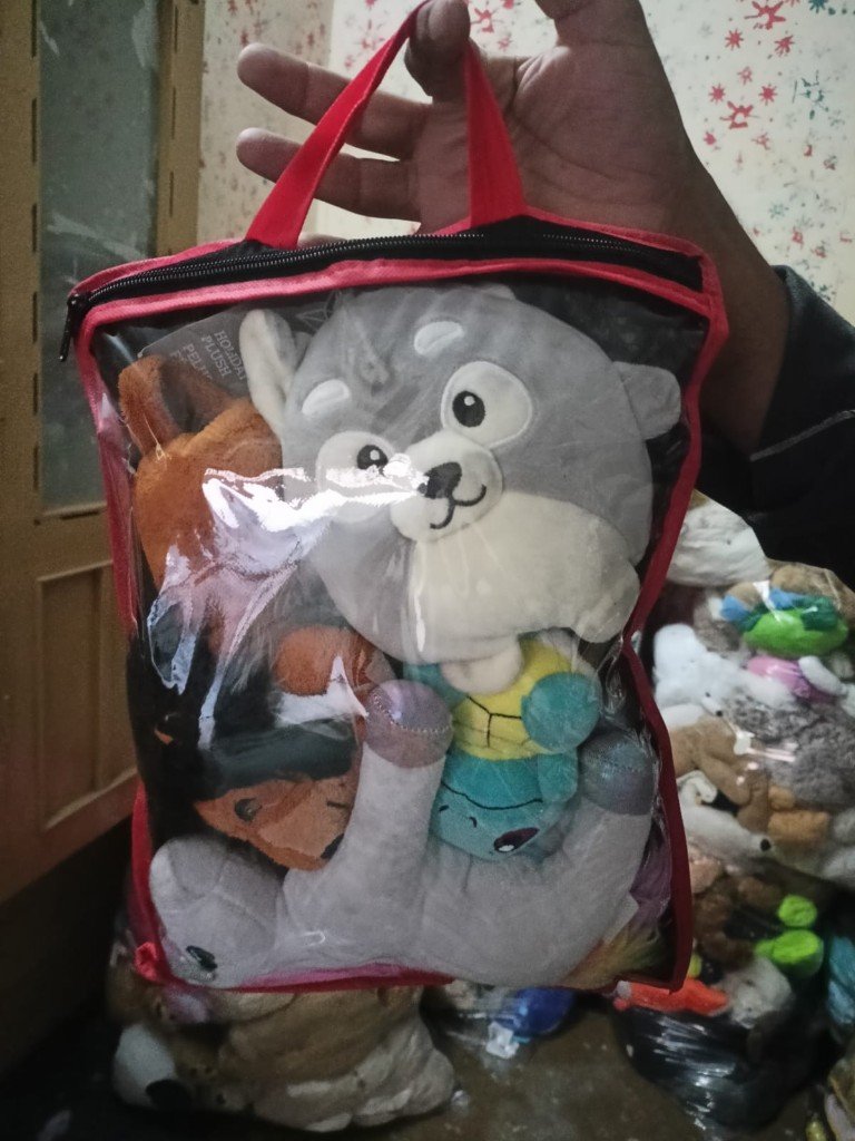 Launched small toy bag with red trim