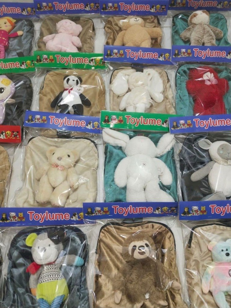 Packaged ToyLume school bags with stuffed toys